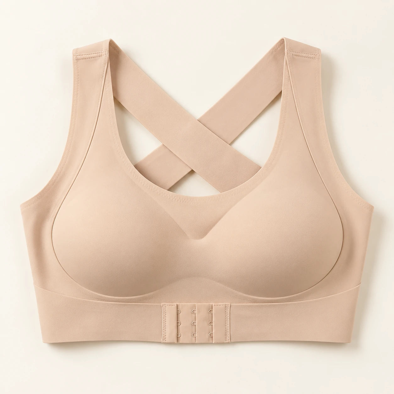 Beige wireless bra with smooth cups and an adjustable front band.